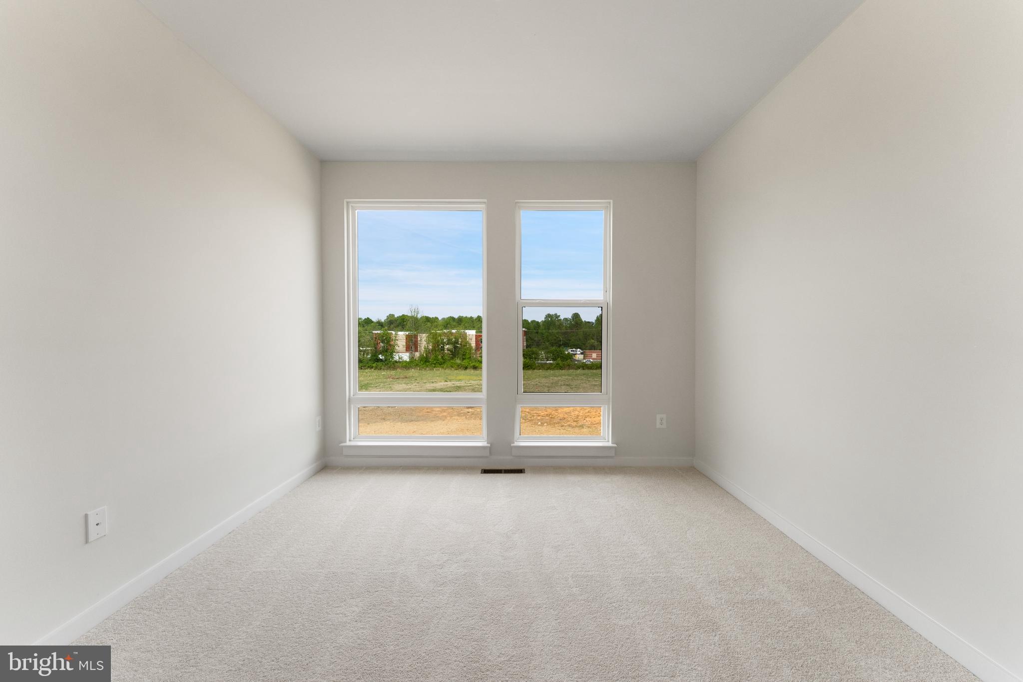 113 Summit Point Boulevard, Unit 19J Bowie, MD 20716 - Photo 33 of 38 an empty room with windows