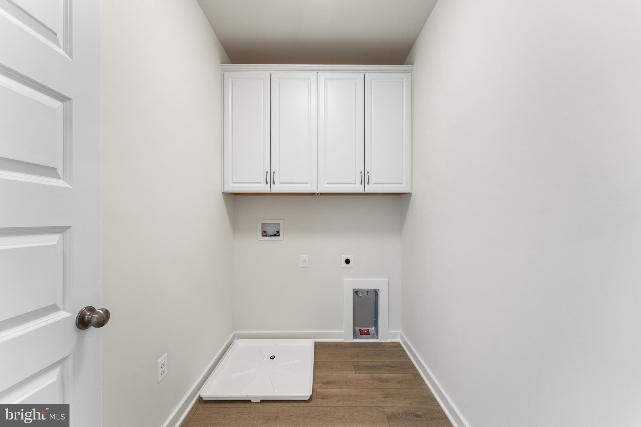 113 Summit Point Boulevard, Unit 19J Bowie, MD 20716 - Photo 36 of 38 a view of room with hardwood floor