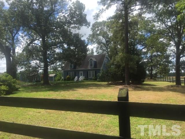 1001 Horse Creek Road Raleigh, NC 27603 - Photo 21 of 21 a view of swimming pool with lawn chairs and large trees