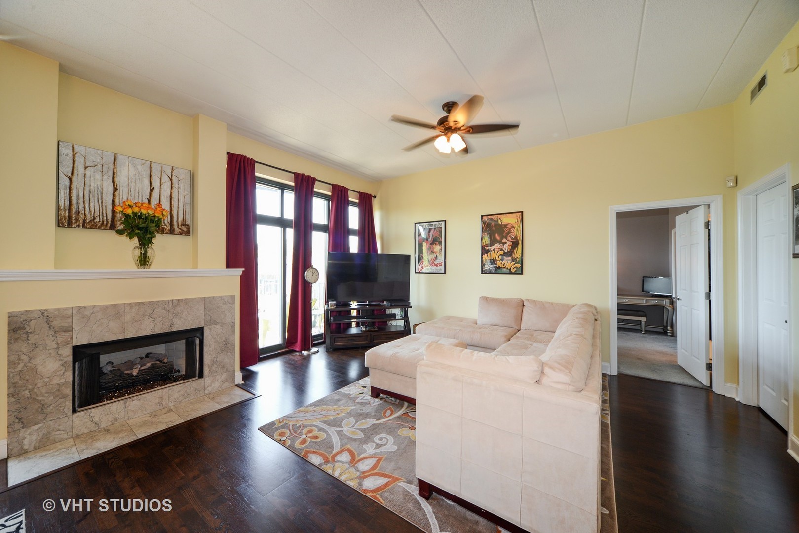 1301 West Washington Boulevard, Unit 404D Chicago, IL 60607 - Photo 2 of 11 a living room with furniture a fireplace and a flat screen tv
