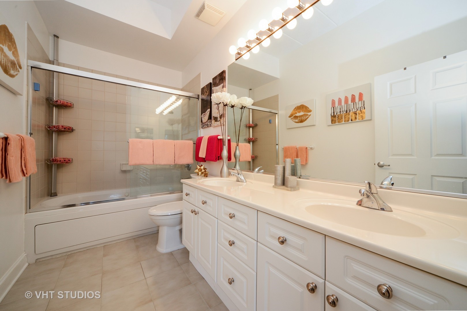 1301 West Washington Boulevard, Unit 404D Chicago, IL 60607 - Photo 7 of 11 a bathroom with a double vanity sink toilet mirror and shower