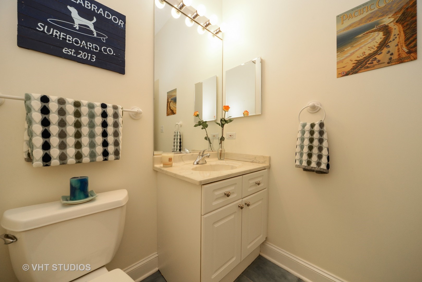 1301 West Washington Boulevard, Unit 404D Chicago, IL 60607 - Photo 8 of 11 a bathroom with a sink mirror vanity and toilet