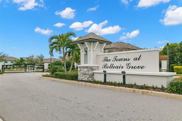 an aerial view of multiple houses with a yard