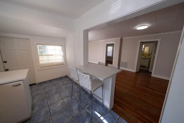 a view of a kitchen from the hallway