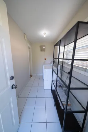 a view of an empty room with a window