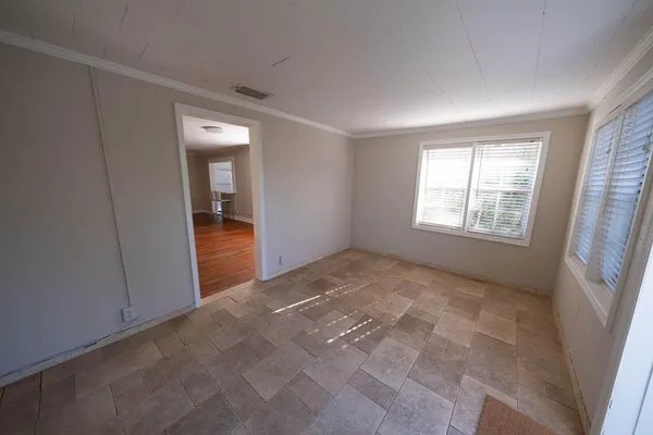 a view of an empty room and window