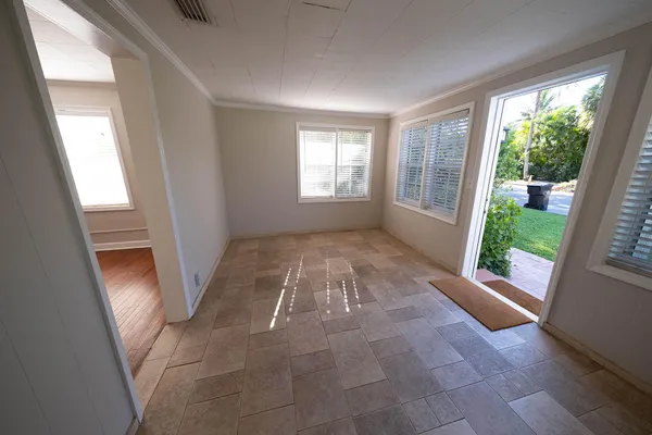 a view of entryway with window and front door