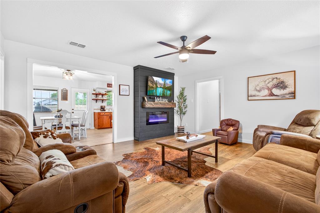 703 College Street Celeste, TX 75423 - Photo 7 of 29 a living room with furniture and wooden floor