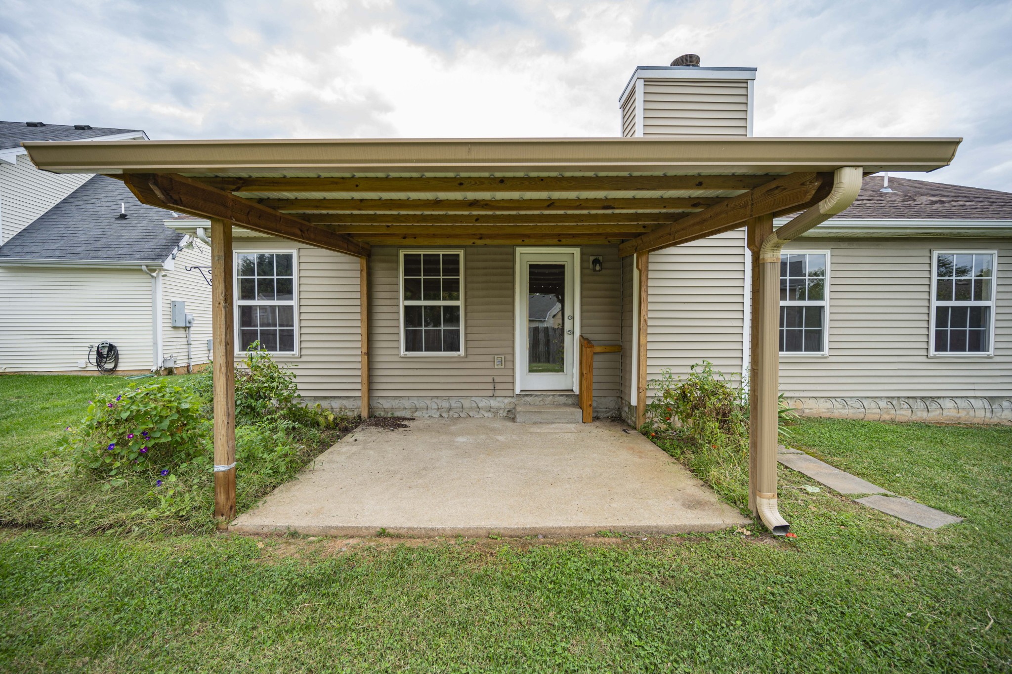 1324 Macduff Drive Murfreesboro, TN 37128 - Photo 11 of 35 a view of a house with brick walls and a yard with plants