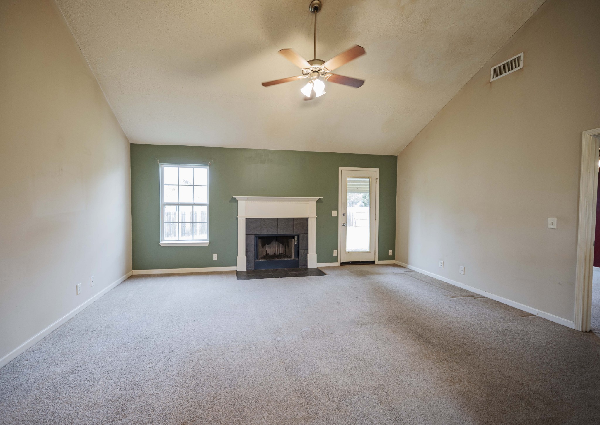 1324 Macduff Drive Murfreesboro, TN 37128 - Photo 14 of 35 an empty room with chandelier fan and windows
