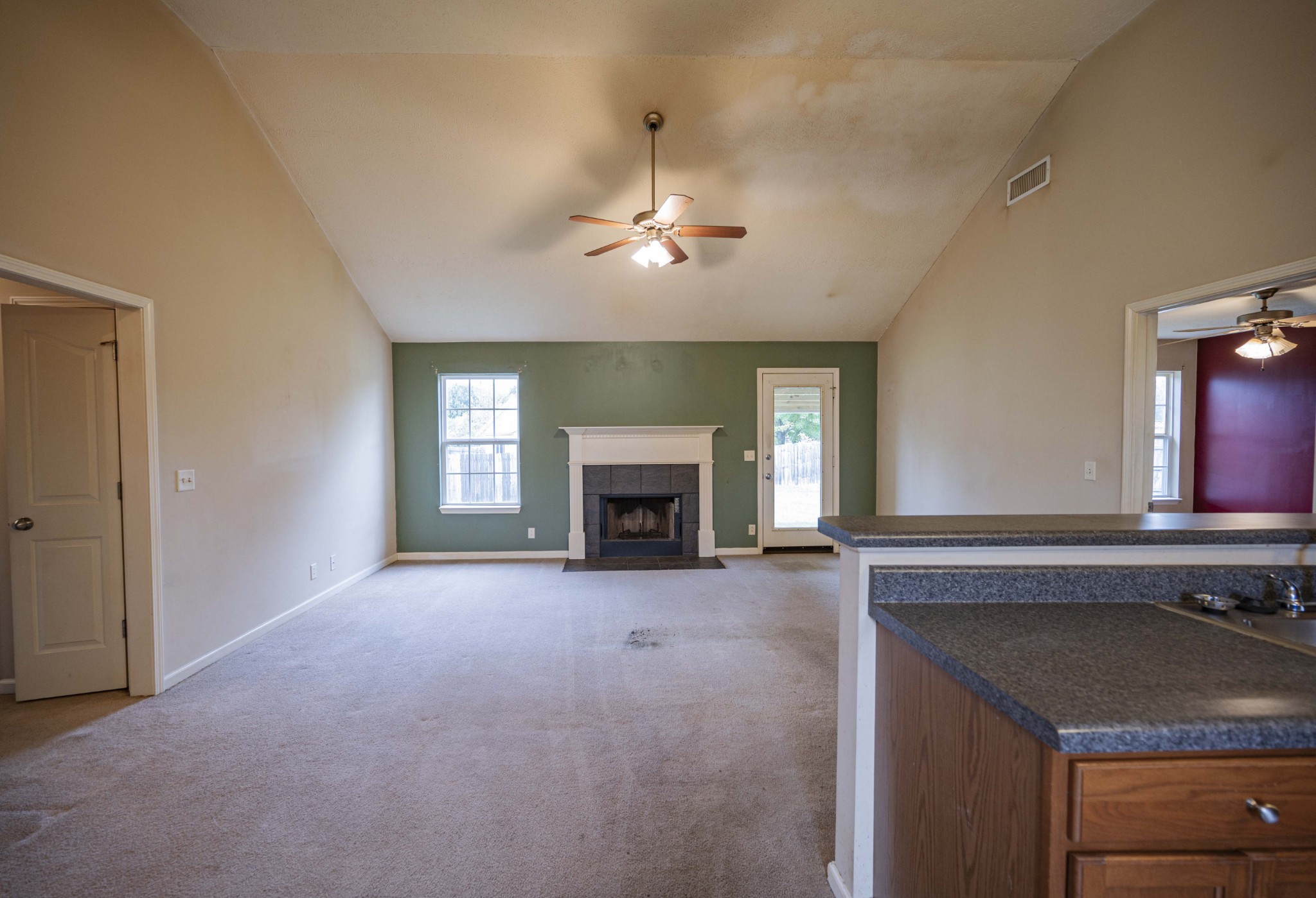 1324 Macduff Drive Murfreesboro, TN 37128 - Photo 15 of 35 a view of an empty room with a fireplace and a window