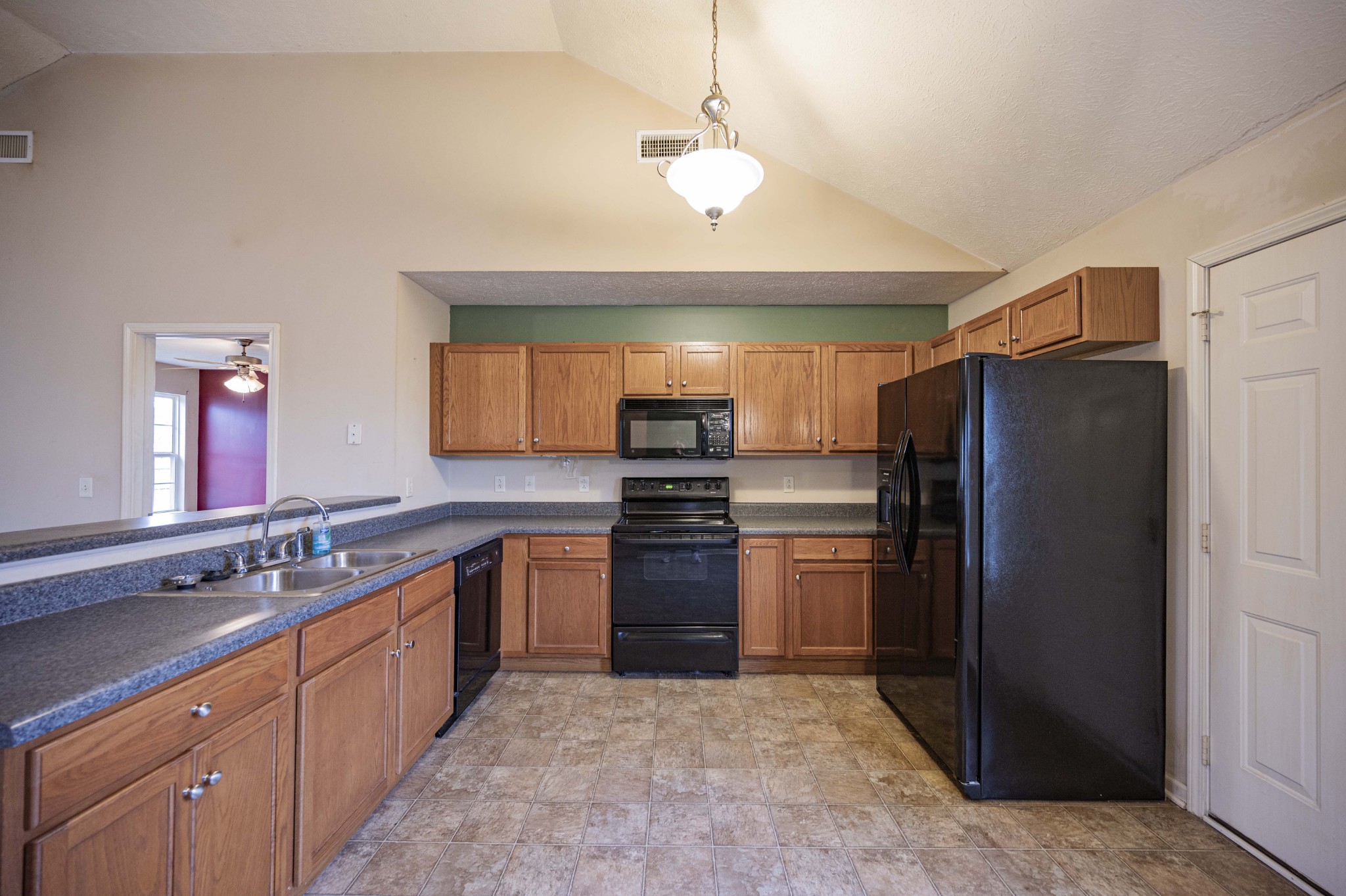 1324 Macduff Drive Murfreesboro, TN 37128 - Photo 17 of 35 a large kitchen with a refrigerator stove and sink
