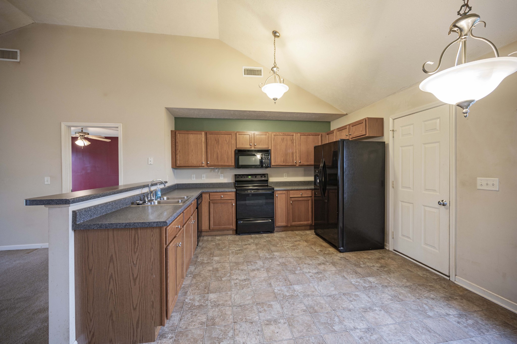 1324 Macduff Drive Murfreesboro, TN 37128 - Photo 18 of 35 a kitchen with refrigerator and cabinets