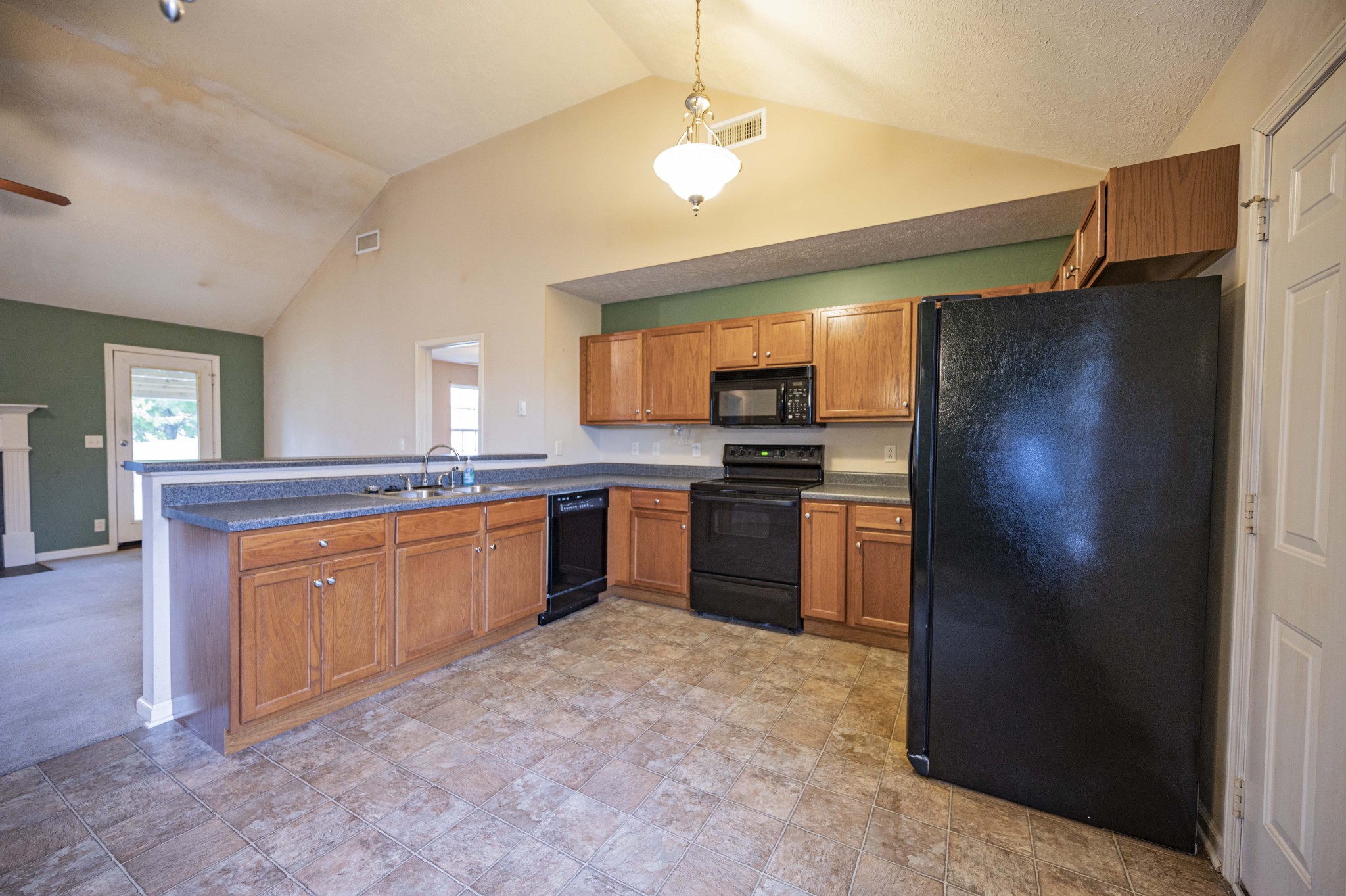 1324 Macduff Drive Murfreesboro, TN 37128 - Photo 19 of 35 a kitchen with stainless steel appliances granite countertop a refrigerator and a stove top oven