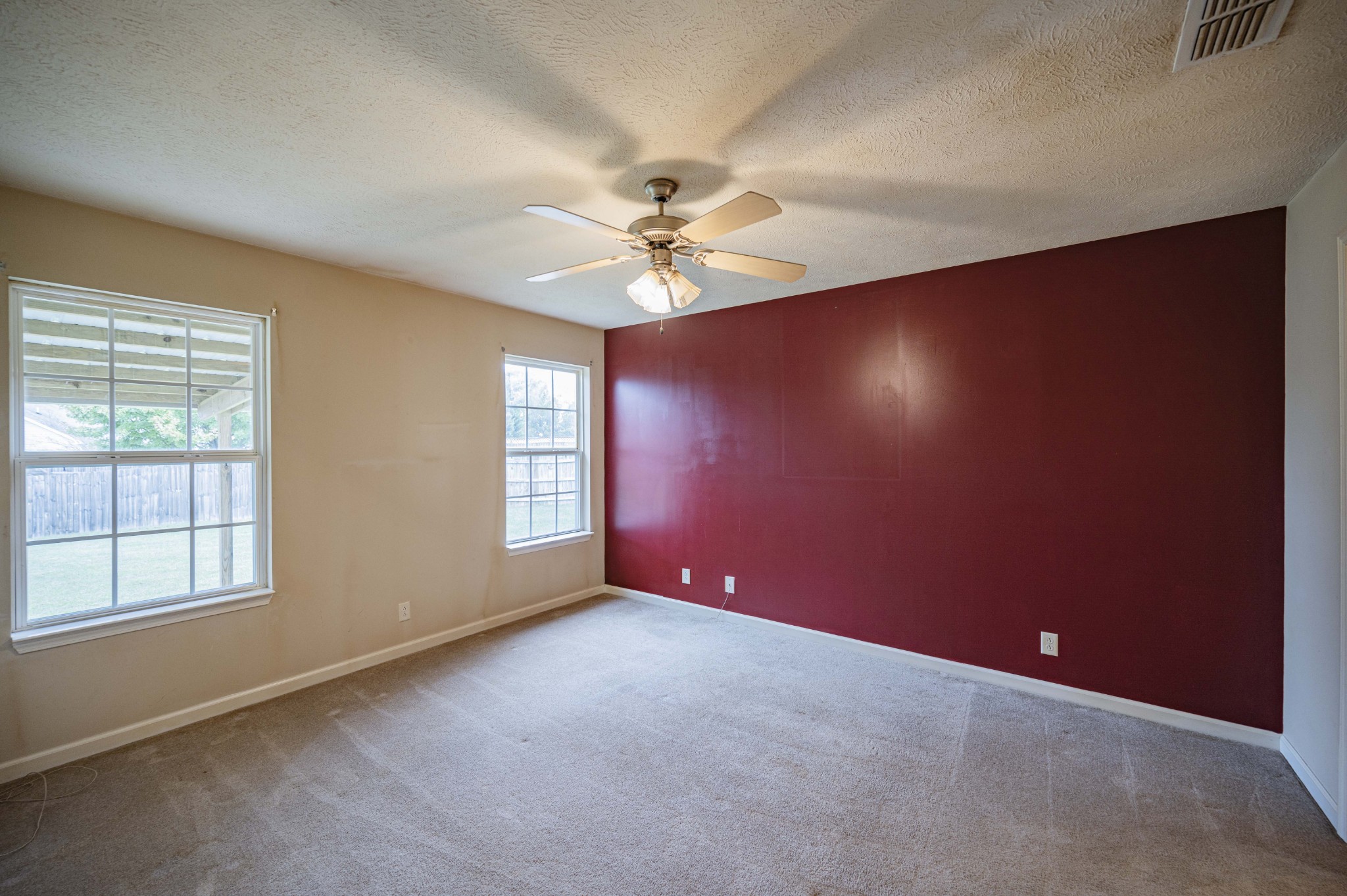 1324 Macduff Drive Murfreesboro, TN 37128 - Photo 23 of 35 an empty room with windows and fan