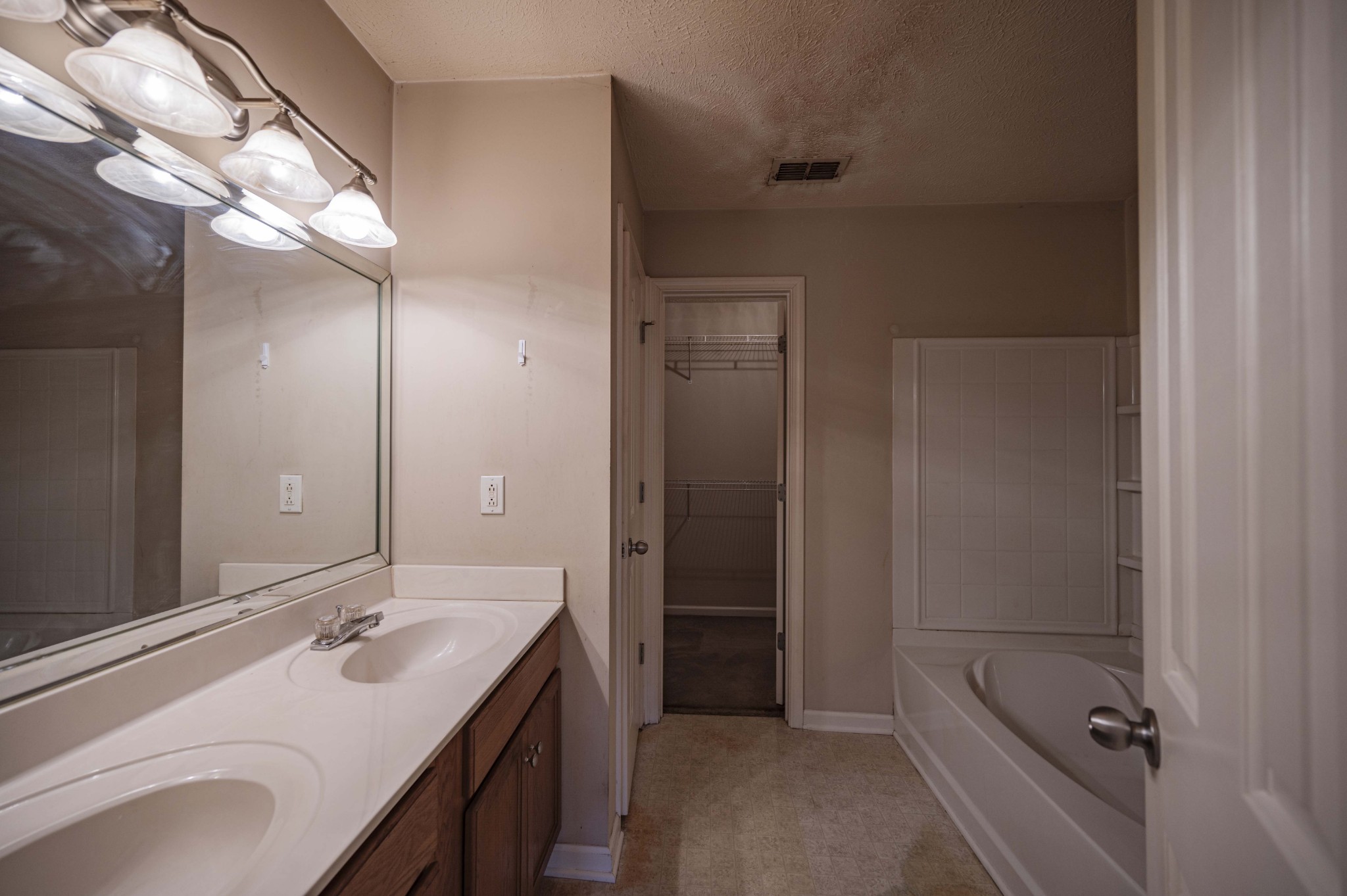 1324 Macduff Drive Murfreesboro, TN 37128 - Photo 26 of 35 a bathroom with a double vanity sink and mirror with shower