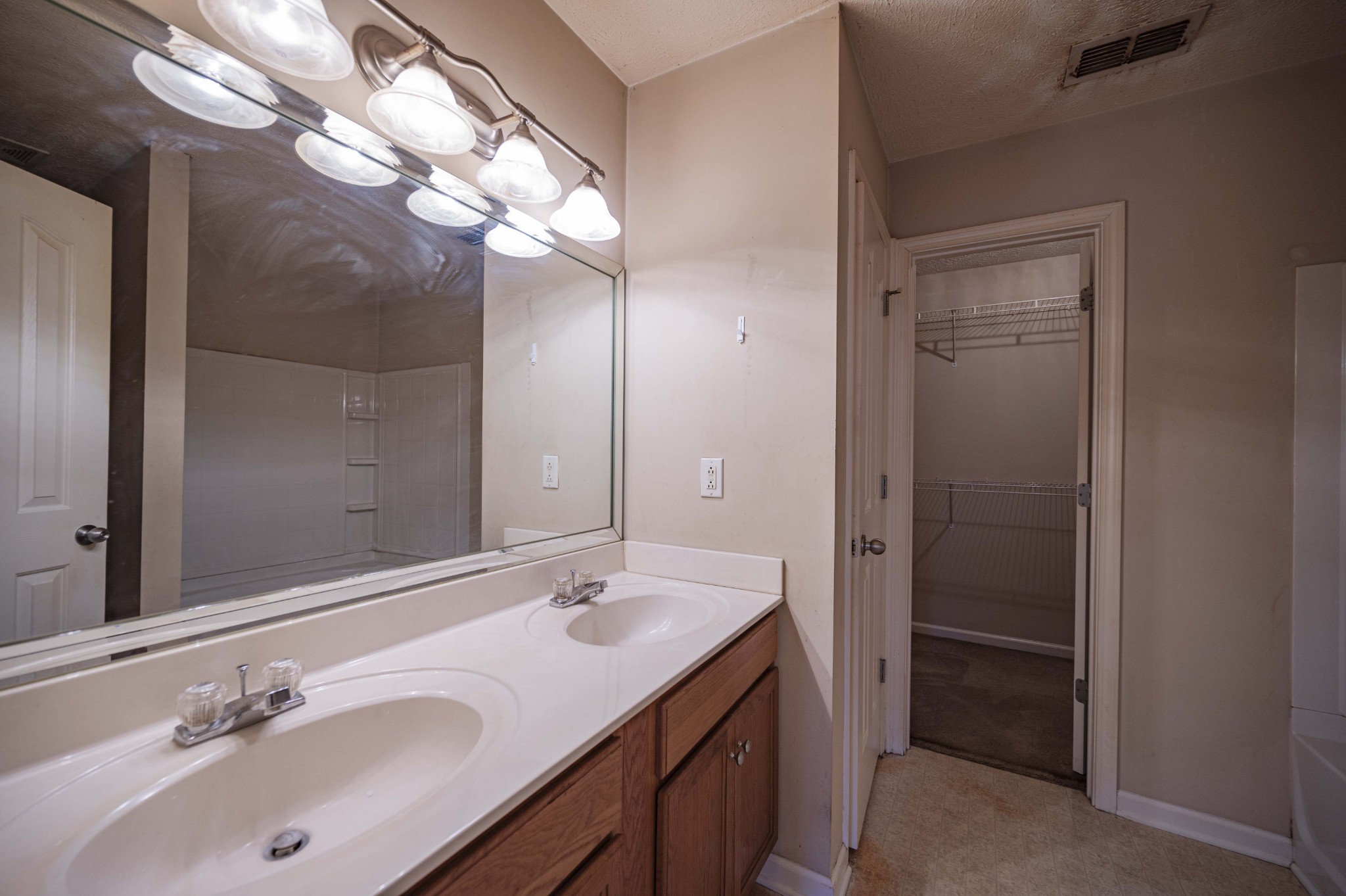 1324 Macduff Drive Murfreesboro, TN 37128 - Photo 27 of 35 a bathroom with a sink double vanity and a mirror