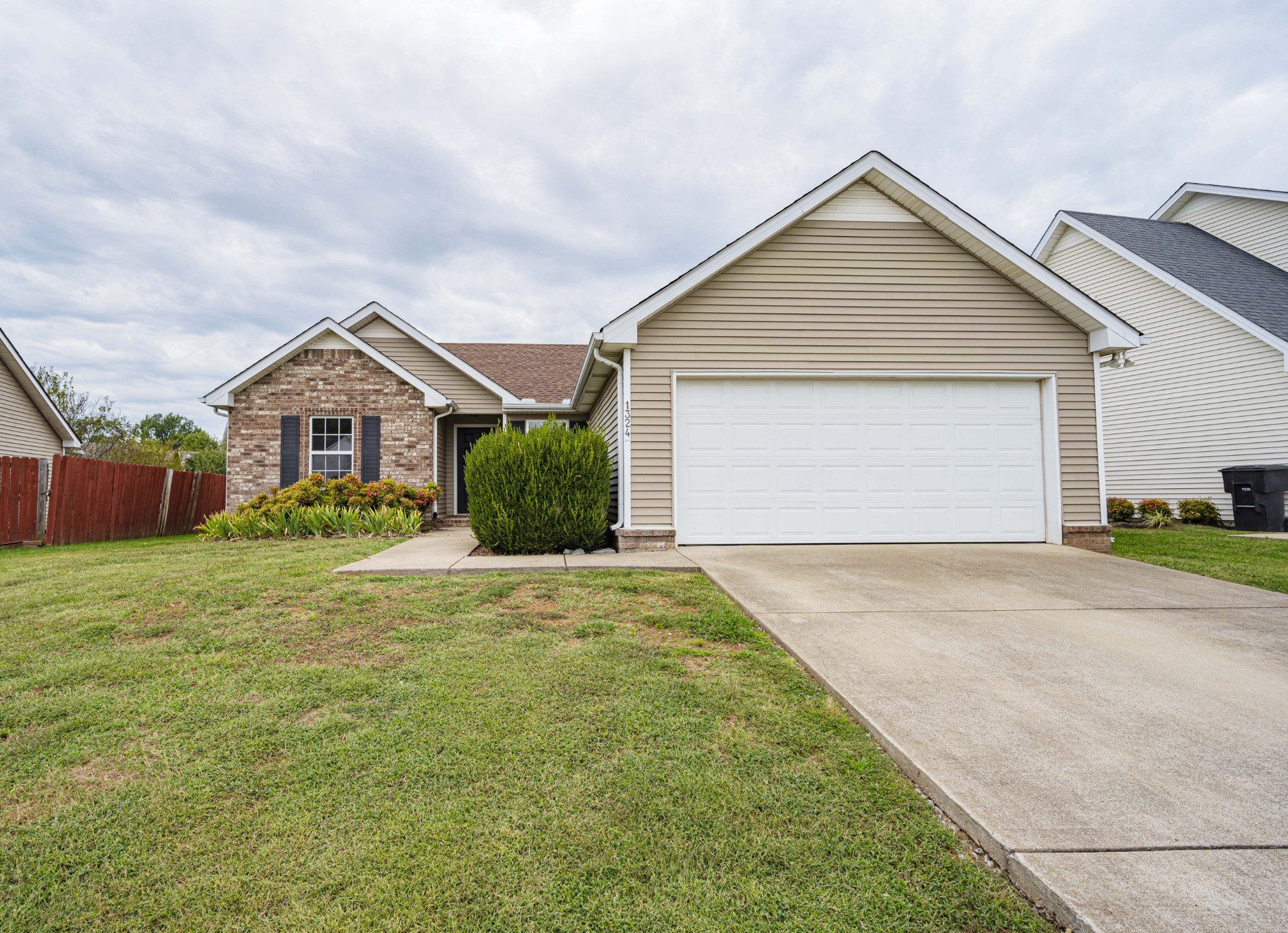 1324 Macduff Drive Murfreesboro, TN 37128 - Photo 3 of 35 front view of house with a yard and potted plants