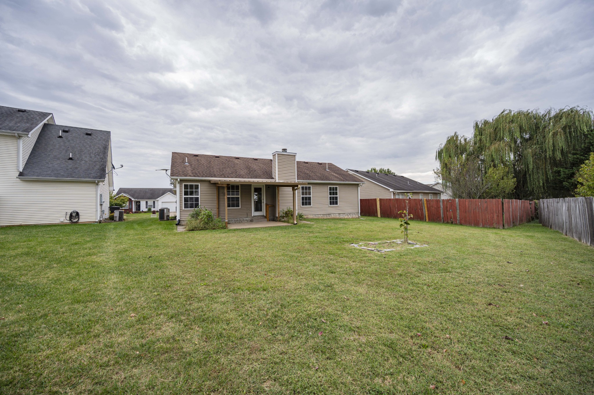 1324 Macduff Drive Murfreesboro, TN 37128 - Photo 5 of 35 a aerial view of a house with a garden and deck