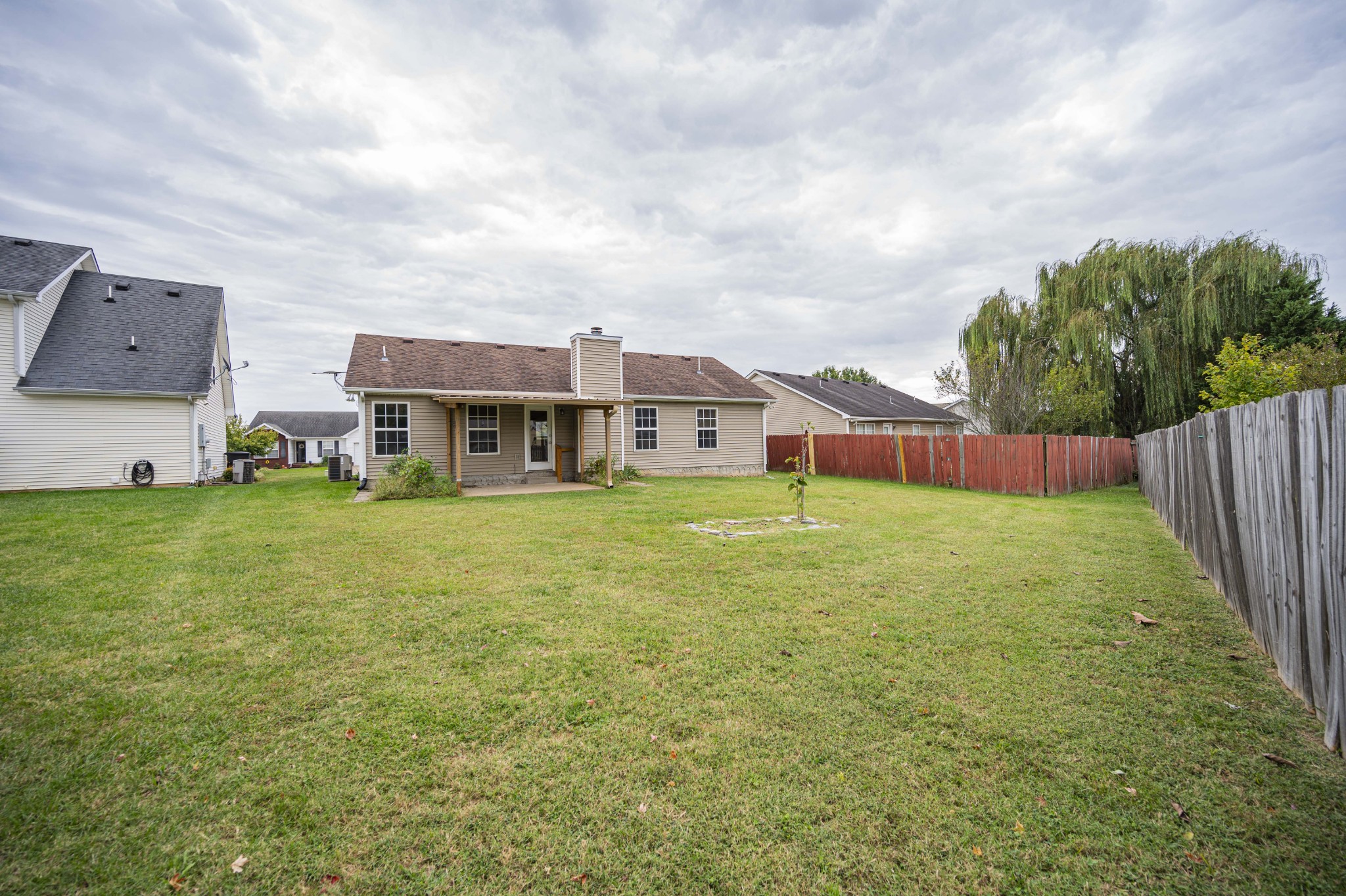 1324 Macduff Drive Murfreesboro, TN 37128 - Photo 7 of 35 a view of an house with backyard space and balcony