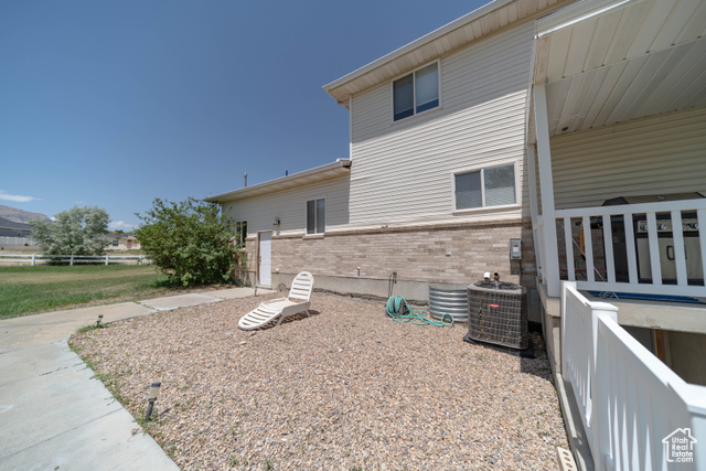 190 600 North Ferron, UT 84523 - Photo 66 of 85 View of side of home featuring brick siding and a cooling unit