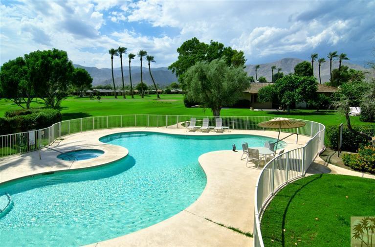 9 Seton Court Rancho Mirage, CA 92270 - Photo 2 of 42 a view of a swimming pool with a garden and plants