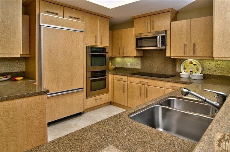 9 Seton Court Rancho Mirage, CA 92270 - Photo 12 of 42 a kitchen with a refrigerator sink and microwave