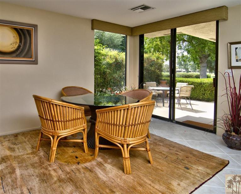 9 Seton Court Rancho Mirage, CA 92270 - Photo 14 of 42 a view of a porch with furniture and a yard