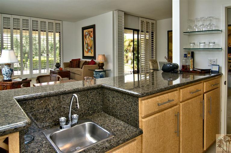 9 Seton Court Rancho Mirage, CA 92270 - Photo 15 of 42 a kitchen with granite countertop a sink and a window