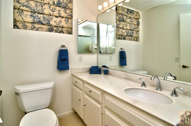 9 Seton Court Rancho Mirage, CA 92270 - Photo 22 of 42 a bathroom with a toilet sink and mirror