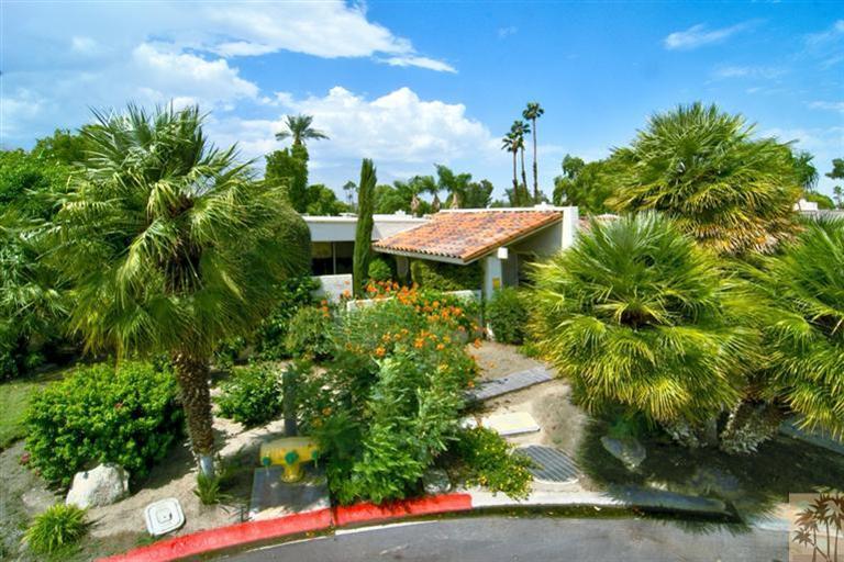 9 Seton Court Rancho Mirage, CA 92270 - Photo 31 of 42 a backyard of a house with table and chairs plants