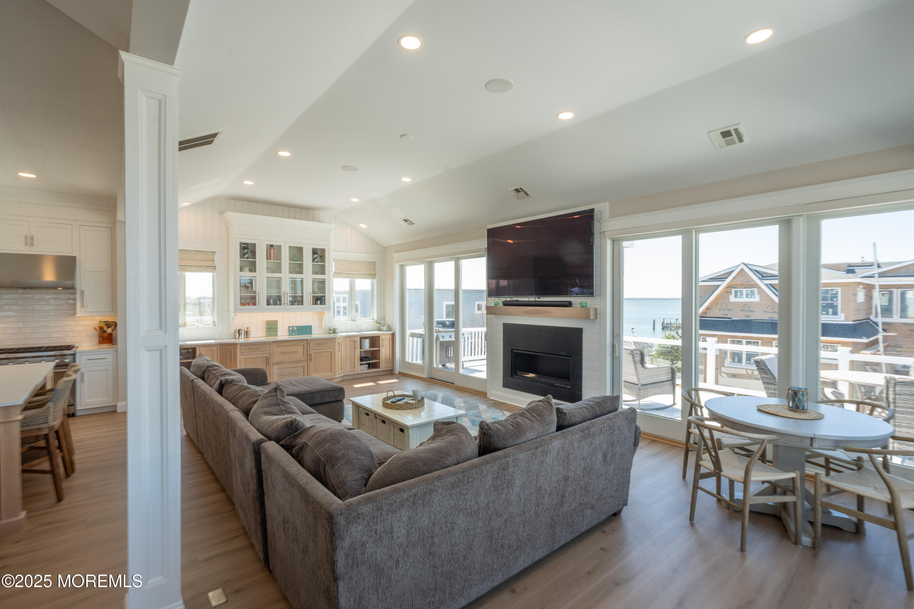 168 E Long Beach Boulevard Beach Haven, NJ 08008 - Photo 15 of 73 a living room with furniture a fireplace and a flat screen tv