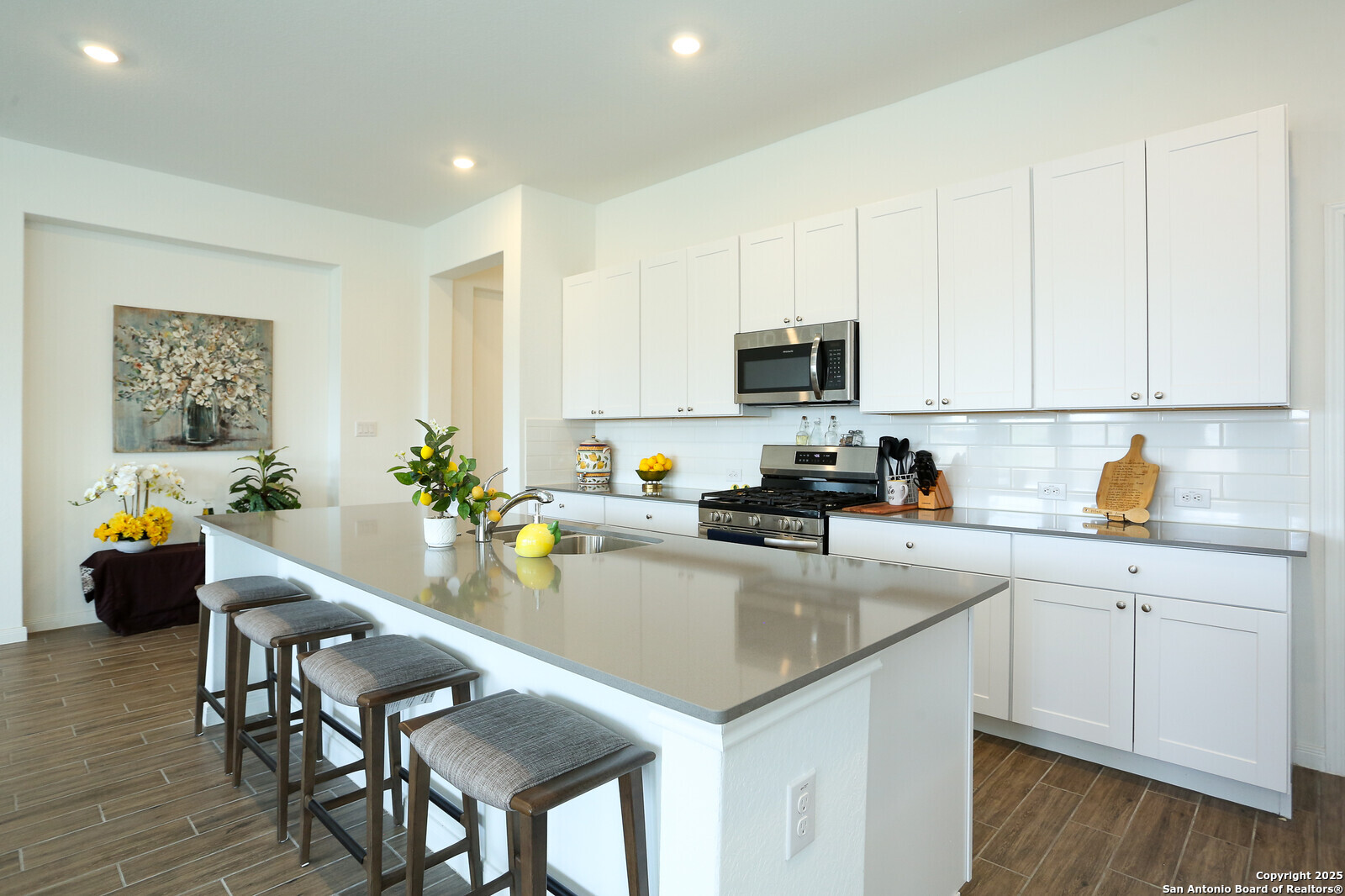 5798 Luciano Ridge Seguin, TX 78155 - Photo 12 of 36 a kitchen with a sink a counter space appliances and cabinets
