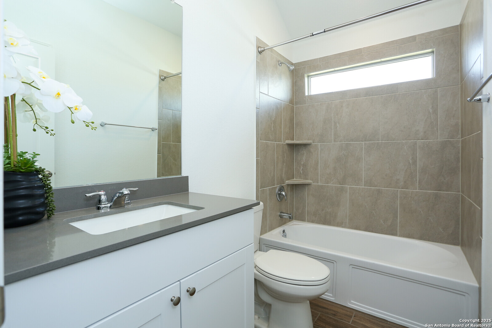 5798 Luciano Ridge Seguin, TX 78155 - Photo 22 of 36 a bathroom with a sink a toilet a mirror a bathtub and shower