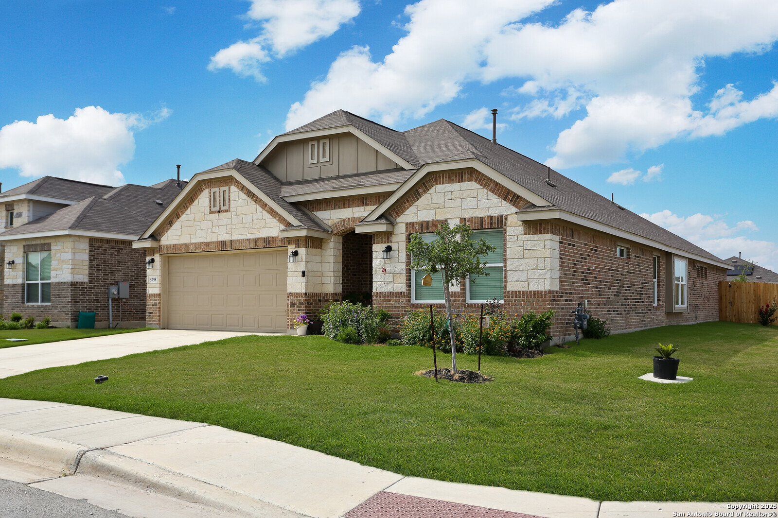 5798 Luciano Ridge Seguin, TX 78155 - Photo 3 of 36 a front view of a house with a yard and garage