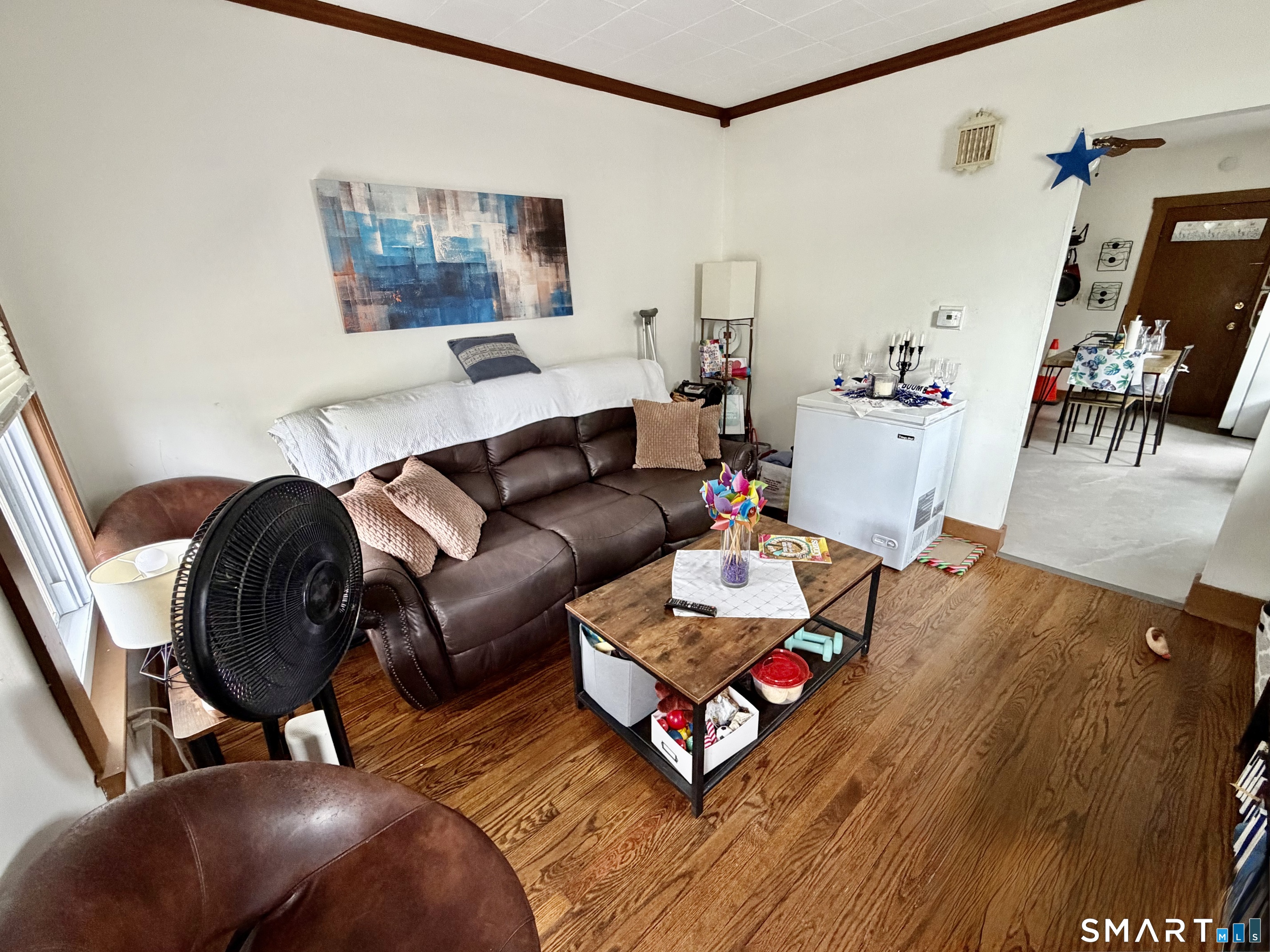 67 Pine Street Meriden, CT 06451 - Photo 4 of 34 a living room with furniture and a flat screen tv