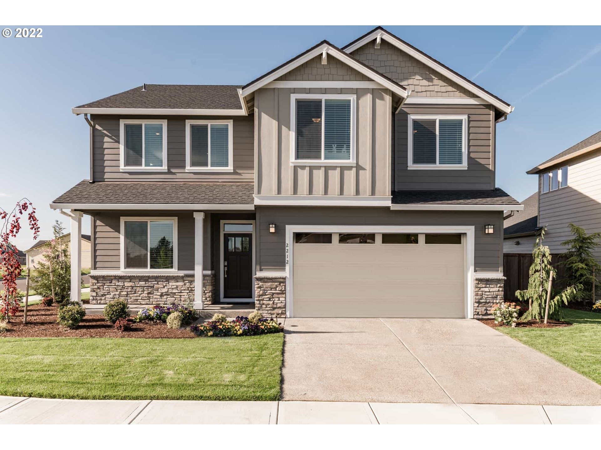 8807 North 5th Street, Unit LT52 Ridgefield, WA 98642 - Photo 1 of 31 a front view of a house with a yard