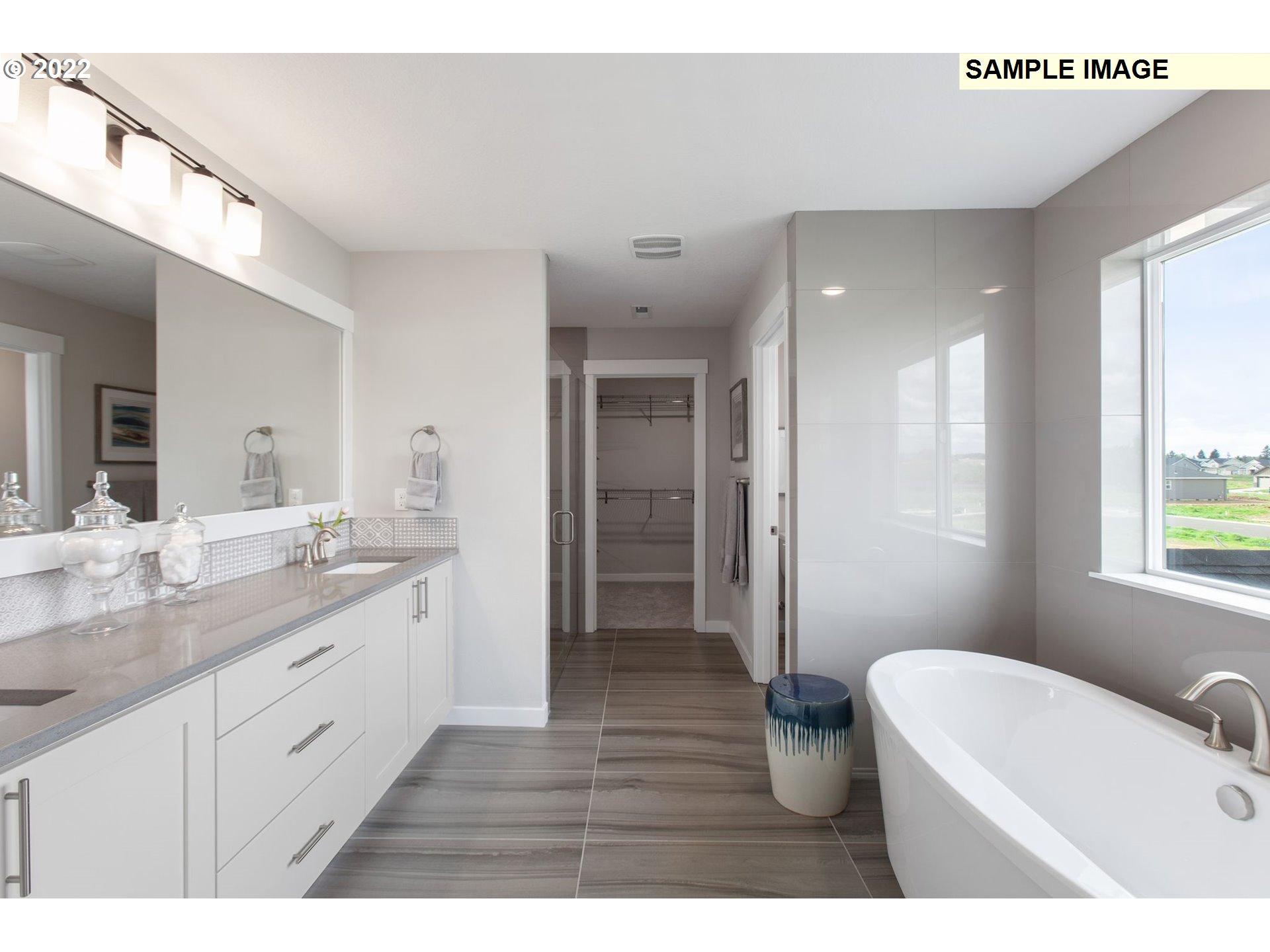 8807 North 5th Street, Unit LT52 Ridgefield, WA 98642 - Photo 29 of 31 a bathroom with a double vanity sink and a bathtub
