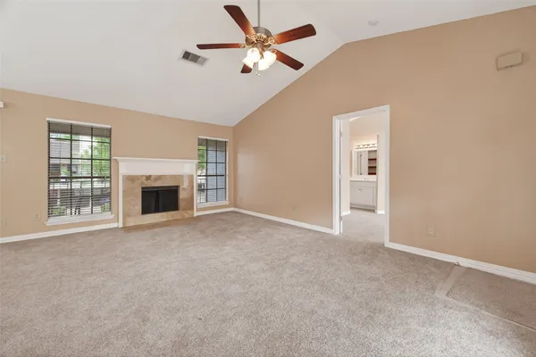 a view of a kitchen with a refrigerator microwave and cabinets