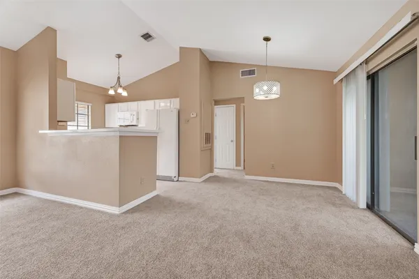 a kitchen with granite countertop a sink and cabinets