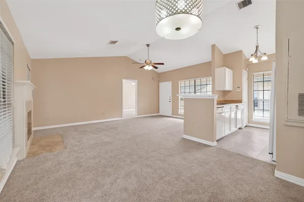 a kitchen with stainless steel appliances white cabinets and a stove