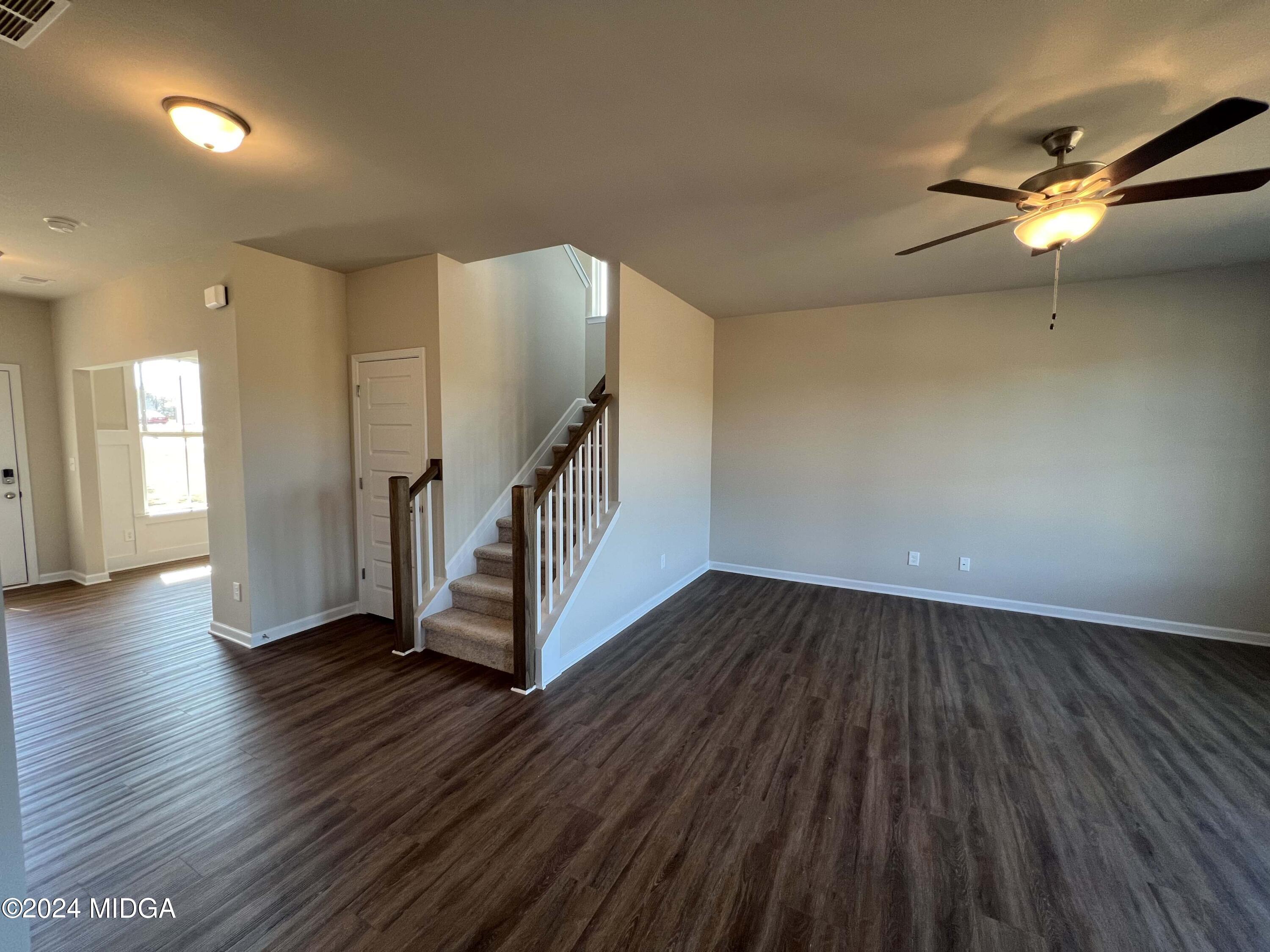 183 Sanders Road Macon, GA 31210 - Photo 15 of 44 wooden floor in an empty room with a window
