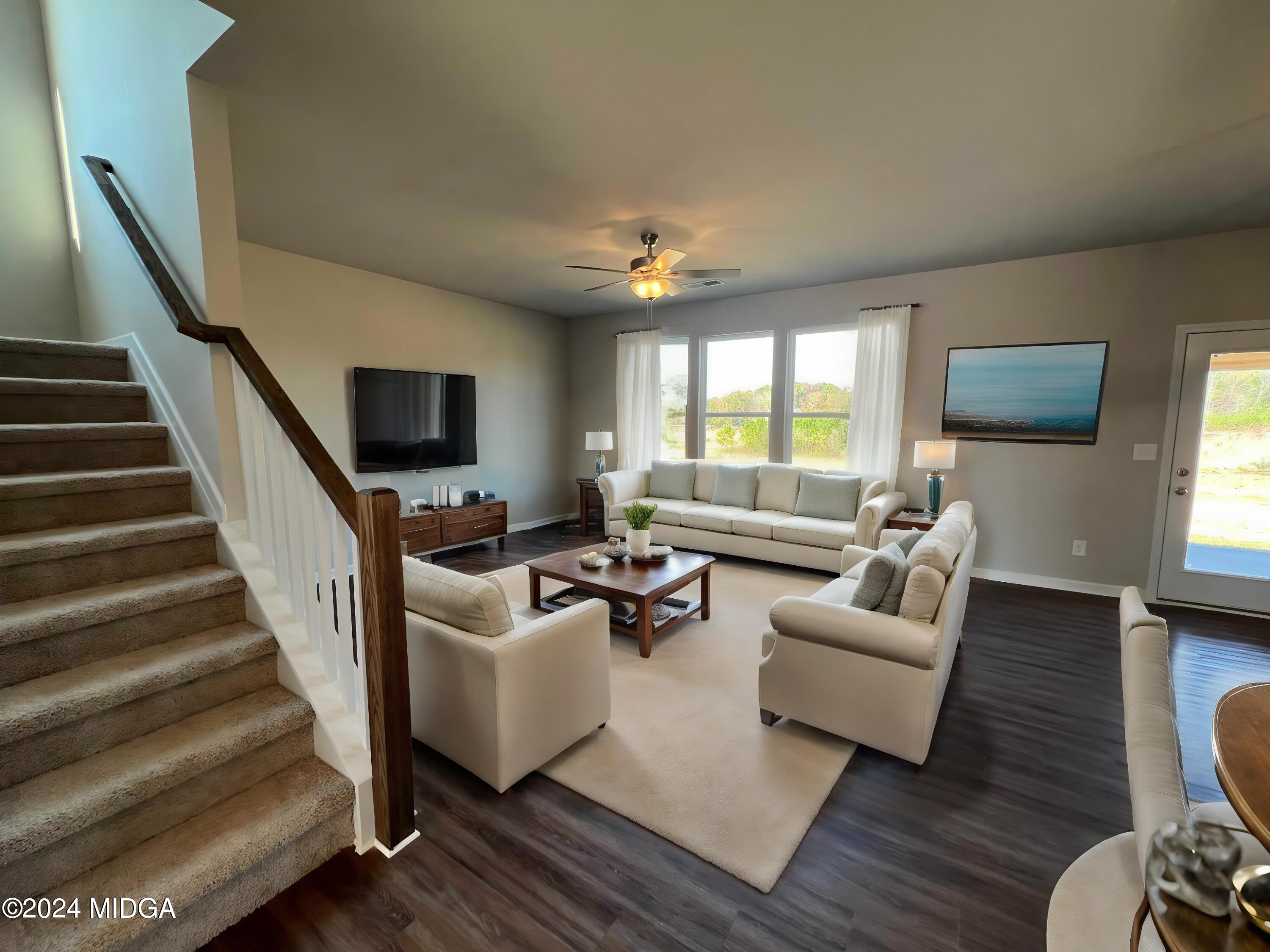 183 Sanders Road Macon, GA 31210 - Photo 17 of 44 a living room with furniture and a flat screen tv
