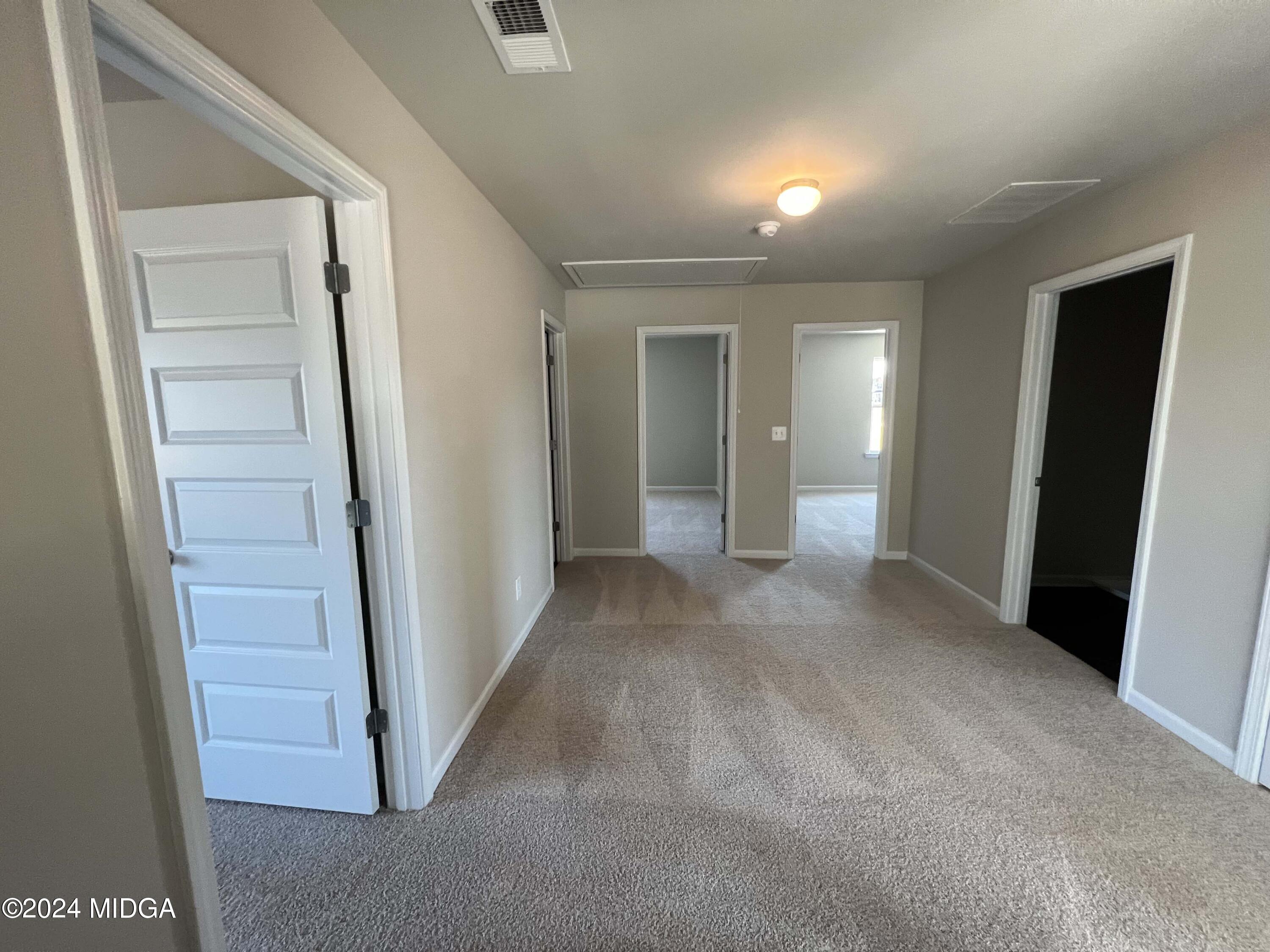 183 Sanders Road Macon, GA 31210 - Photo 20 of 44 a view of a hallway with wooden floor and entryway