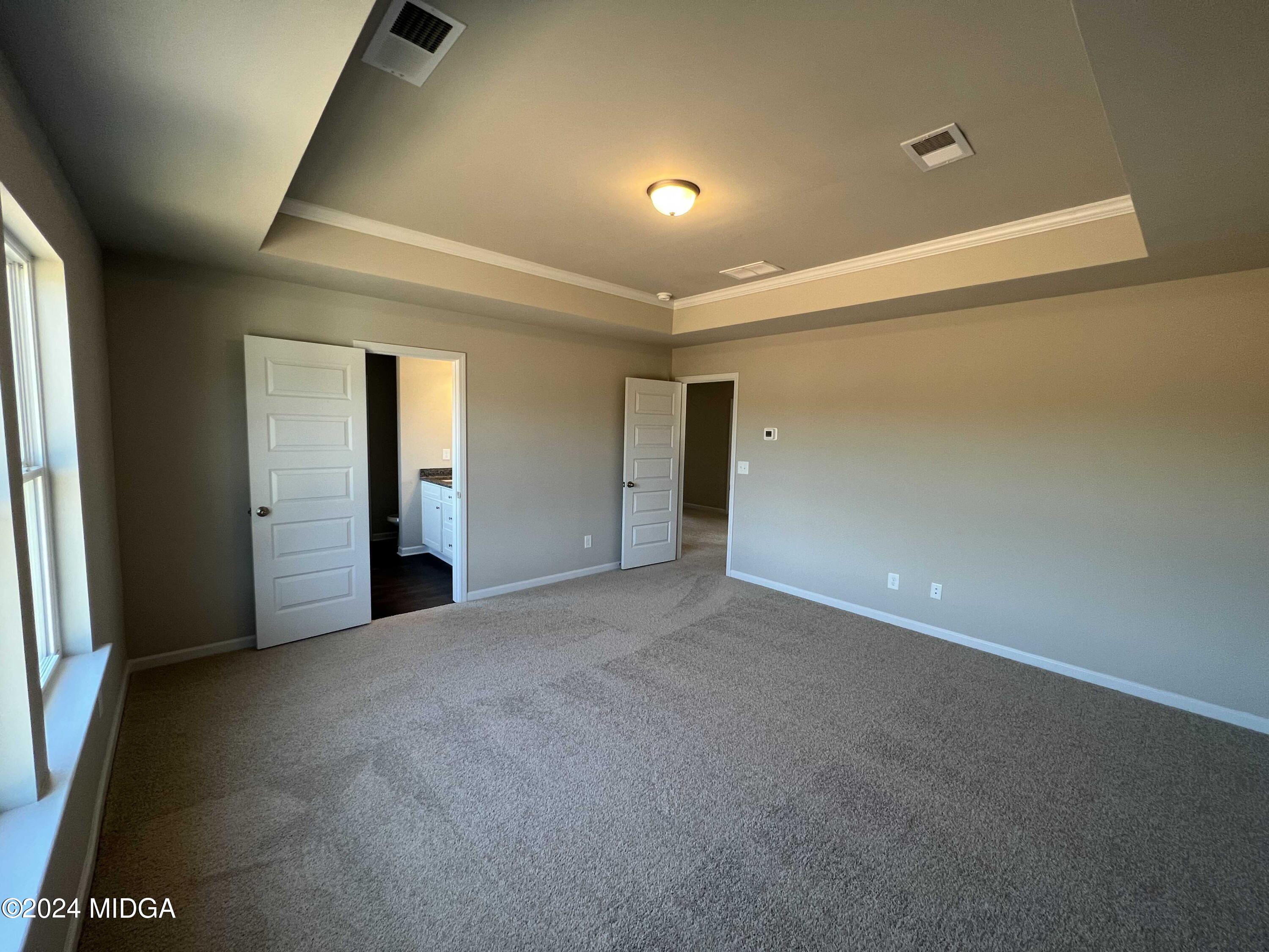 183 Sanders Road Macon, GA 31210 - Photo 23 of 44 a view of an empty room with wooden floor