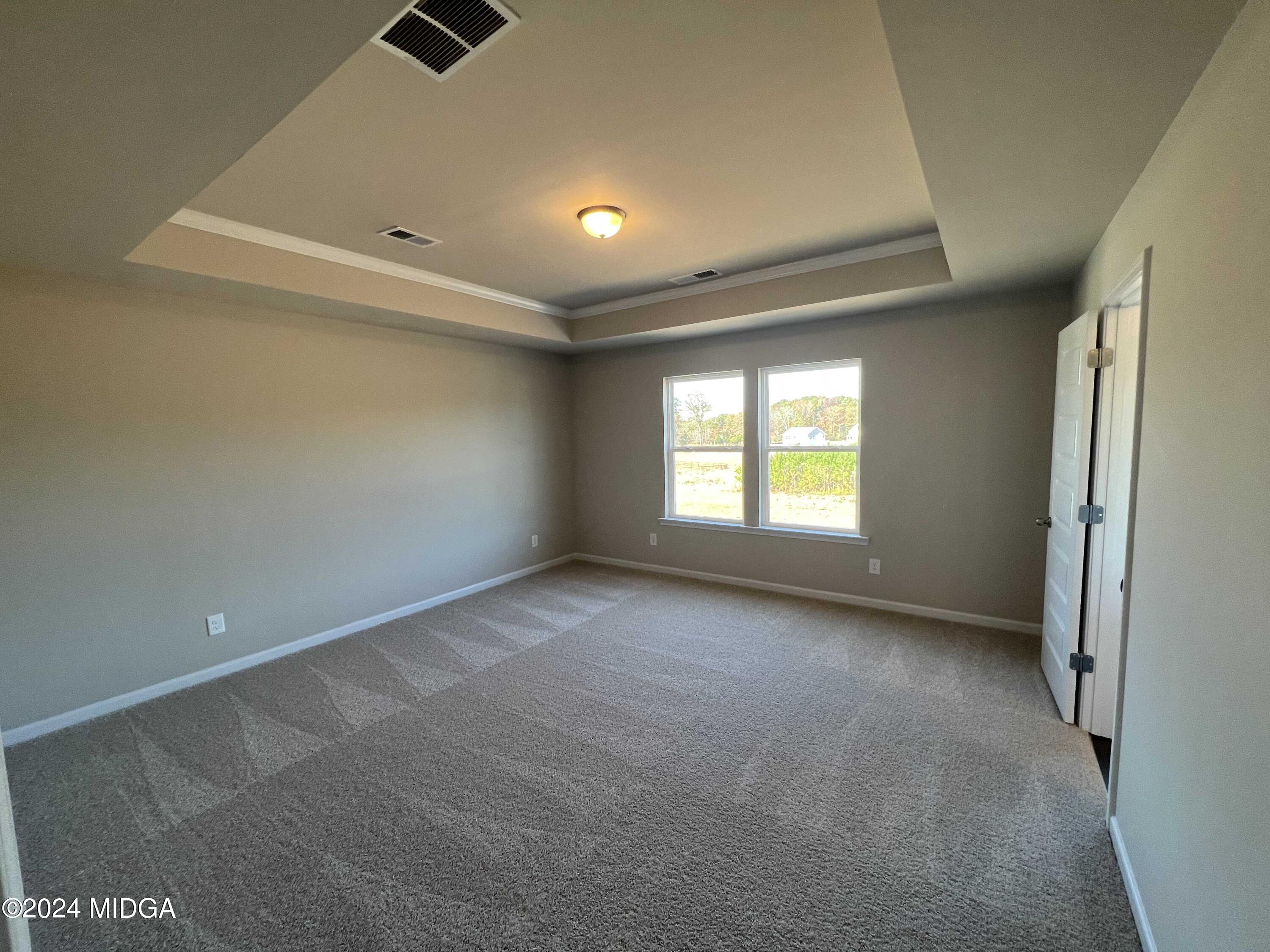 183 Sanders Road Macon, GA 31210 - Photo 24 of 44 a view of an empty room with a window