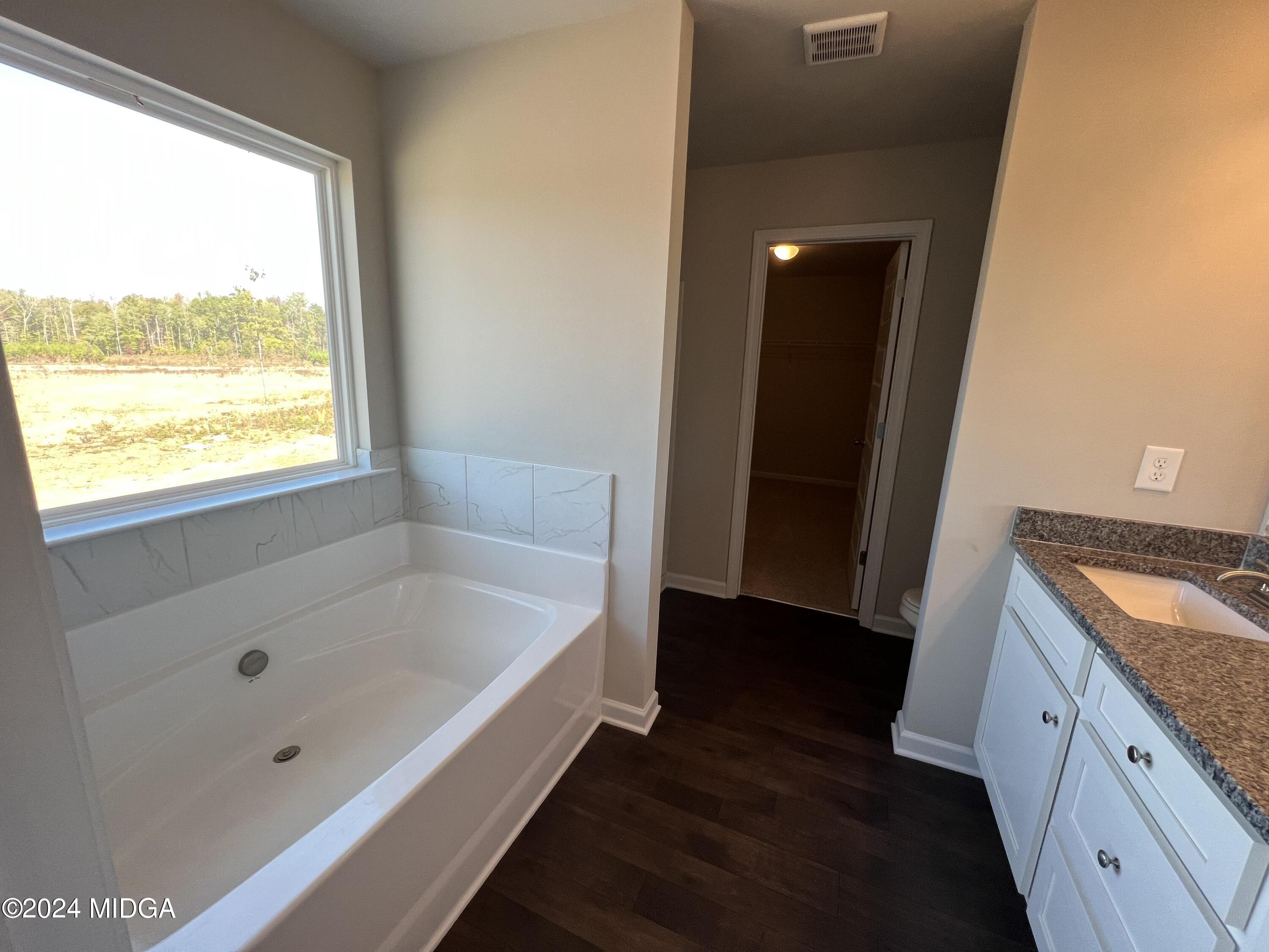 183 Sanders Road Macon, GA 31210 - Photo 27 of 44 a bathroom with a bathtub and a sink