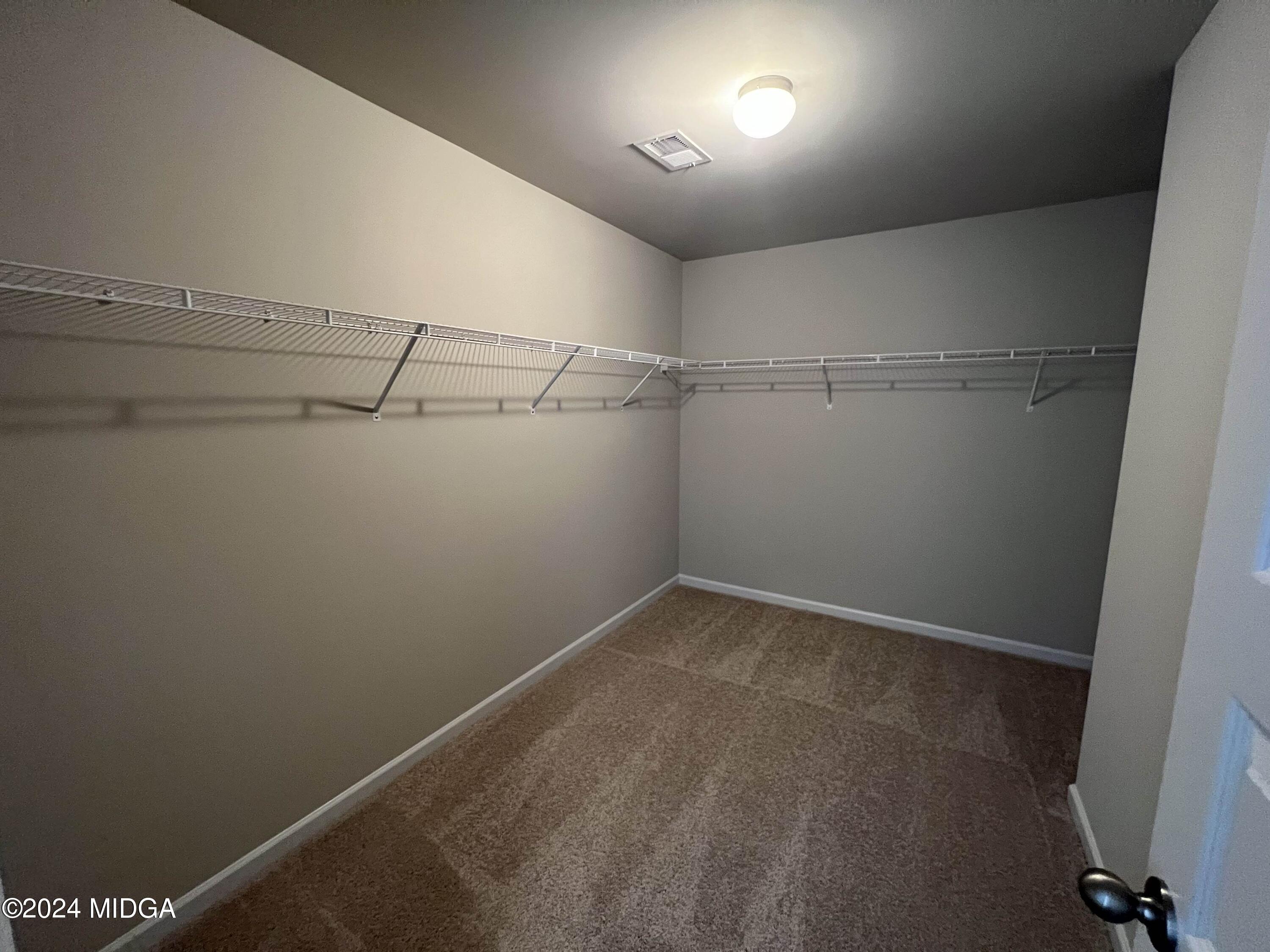 183 Sanders Road Macon, GA 31210 - Photo 30 of 44 a view of a room with racks on the wall