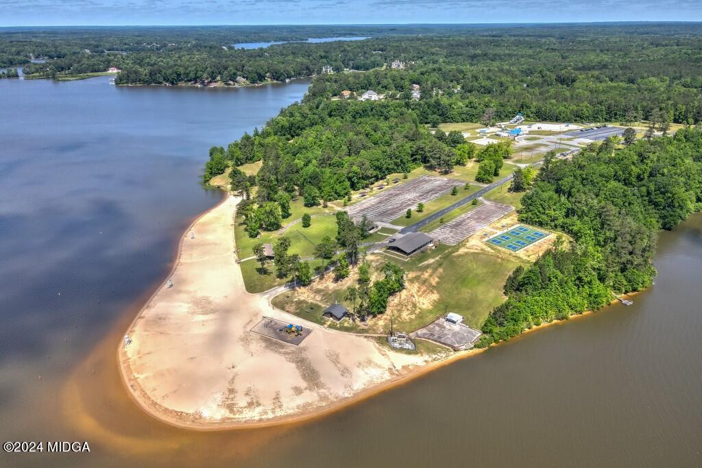 183 Sanders Road Macon, GA 31210 - Photo 43 of 44 an aerial view of a house with a yard and lake view
