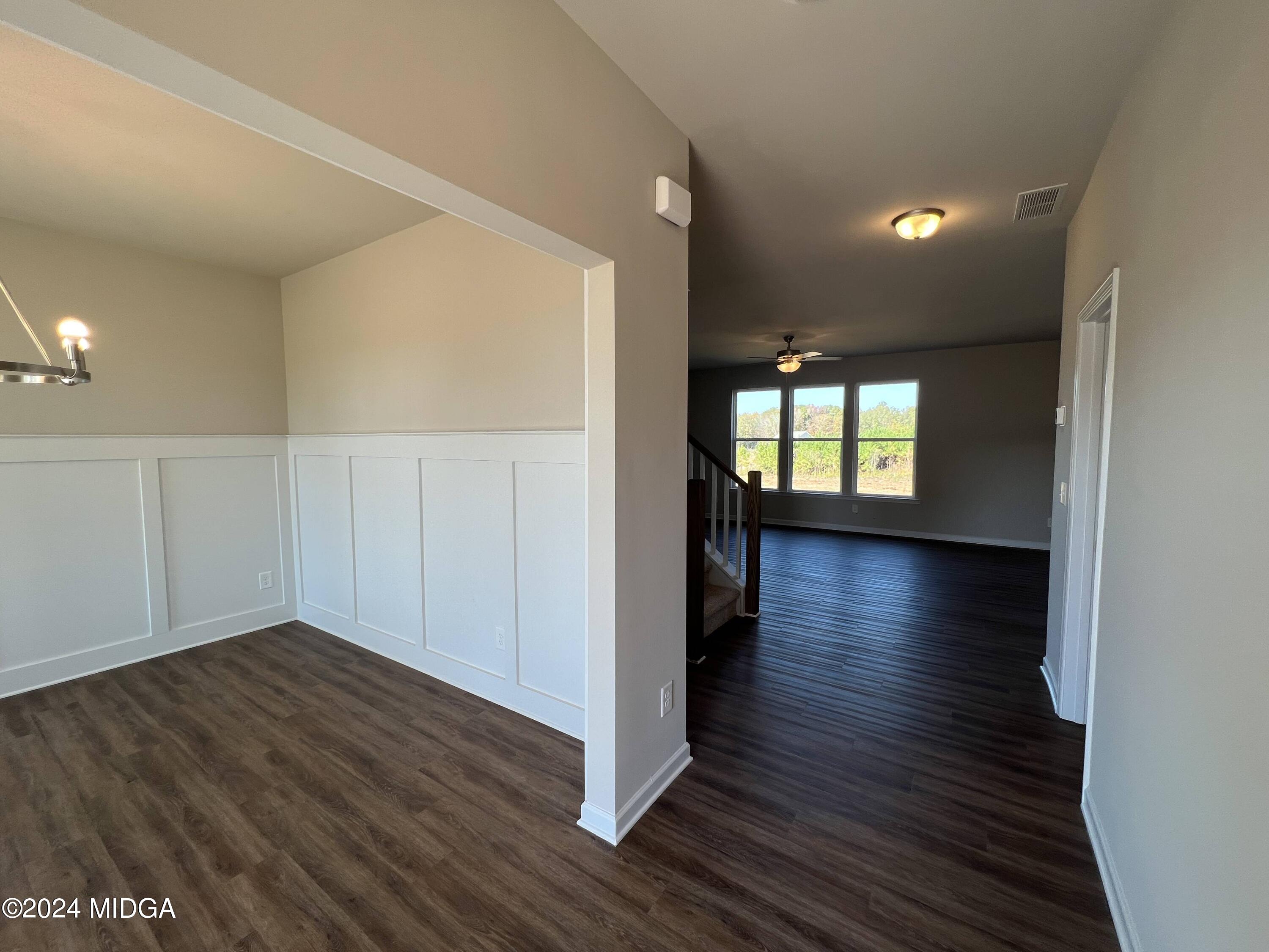 183 Sanders Road Macon, GA 31210 - Photo 6 of 44 wooden floor in an empty room with a window